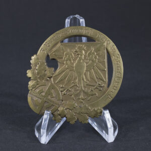 Front side of the Deutscher Turnerbund 3. Bundesturnfest 1930 tinnie, showing the detailed design and event inscription