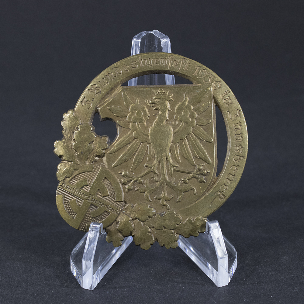 Front side of the Deutscher Turnerbund 3. Bundesturnfest 1930 tinnie, showing the detailed design and event inscription