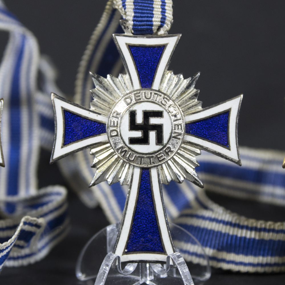 Front side of the silver Mother’s Cross, highlighting the detailed enamel design and central emblem.