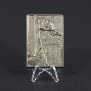 Overview of a 1-3-1935 “Frei ist die Saar” commemorative tinnie, showing the small metal badge.