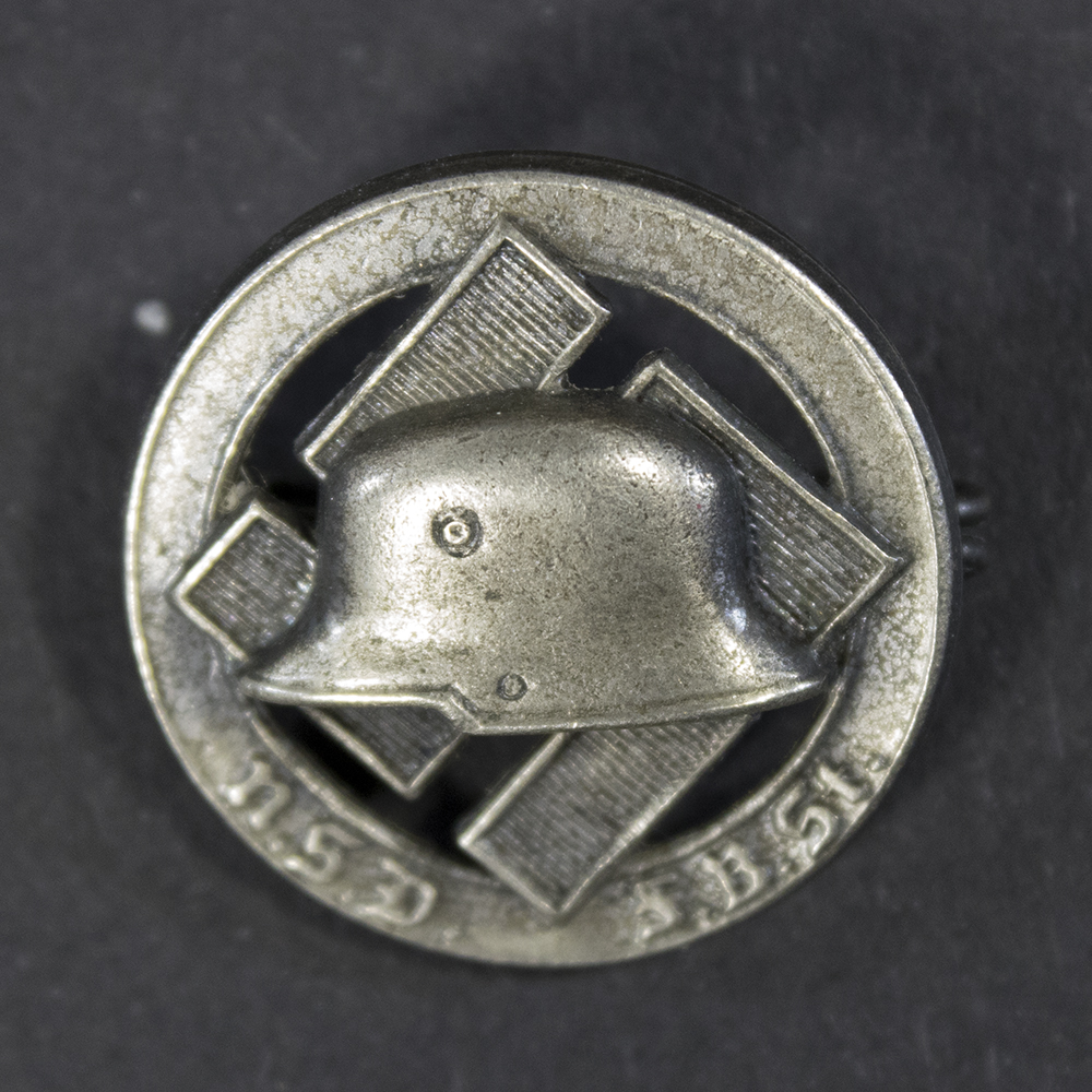 Front side of the WWII German N.S.D.F.B.St membership pin, featuring the intricate design with raised lettering and polished finish.