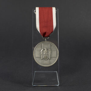 WWII German Volkspflege Medal displayed flat, showing the front side with detailed embossed design and attached suspension ring.