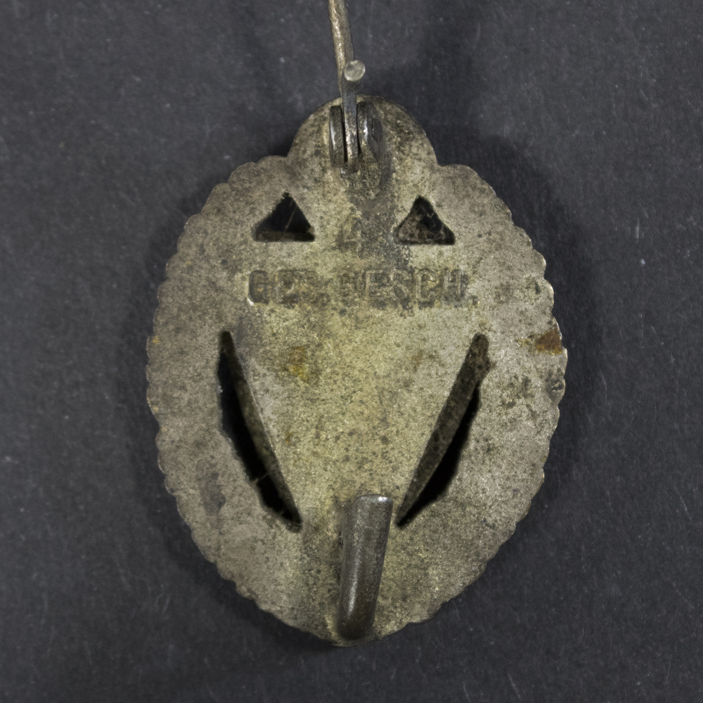 Back side of the Kyffhäuser 25-Year Membership Honor Pin, showing the smooth reverse surface and the stick pin attachment extending downward.