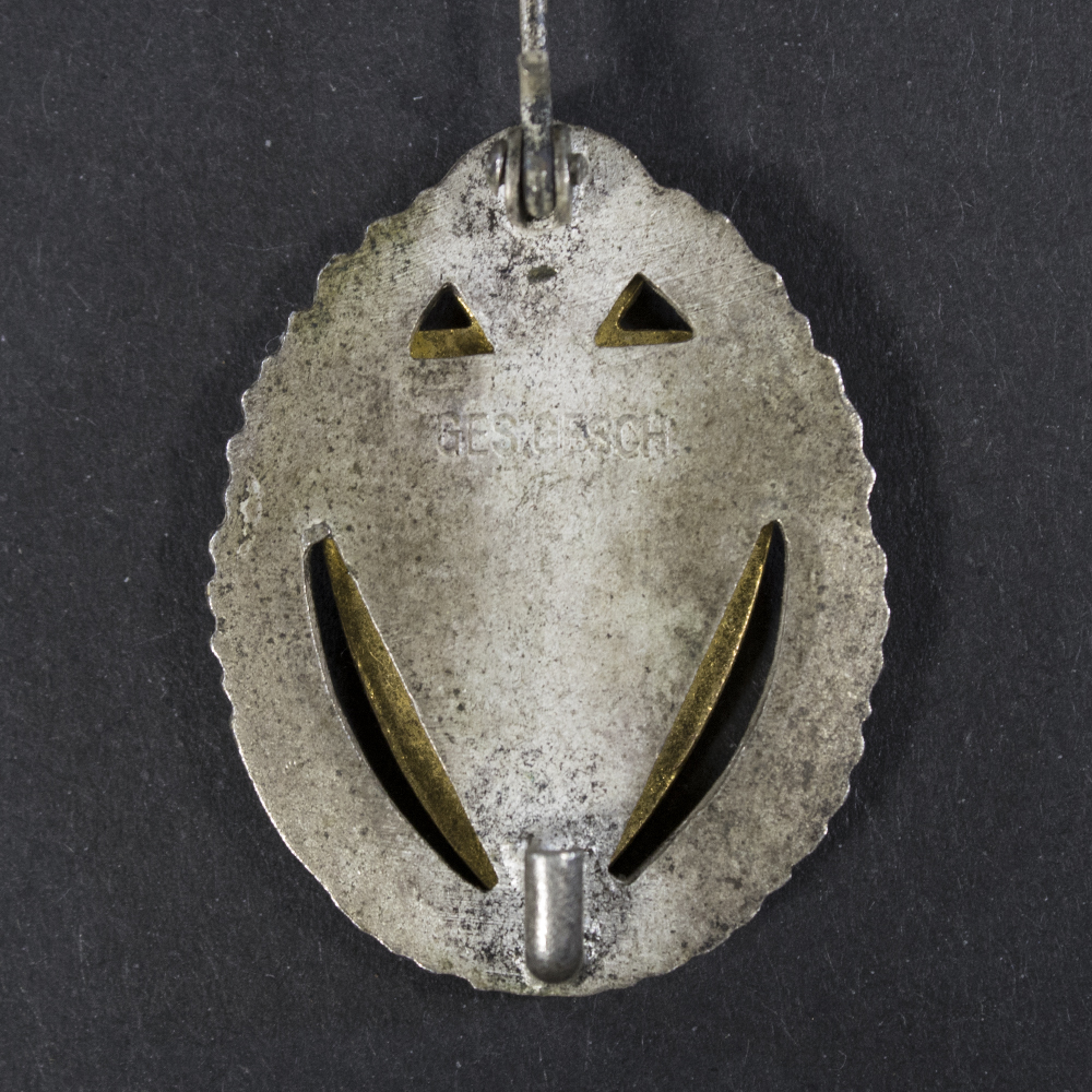 Back side of the Kyffhäuser 25-Year Membership Honor Pin, showing the smooth reverse surface and the stick pin attachment extending downward.