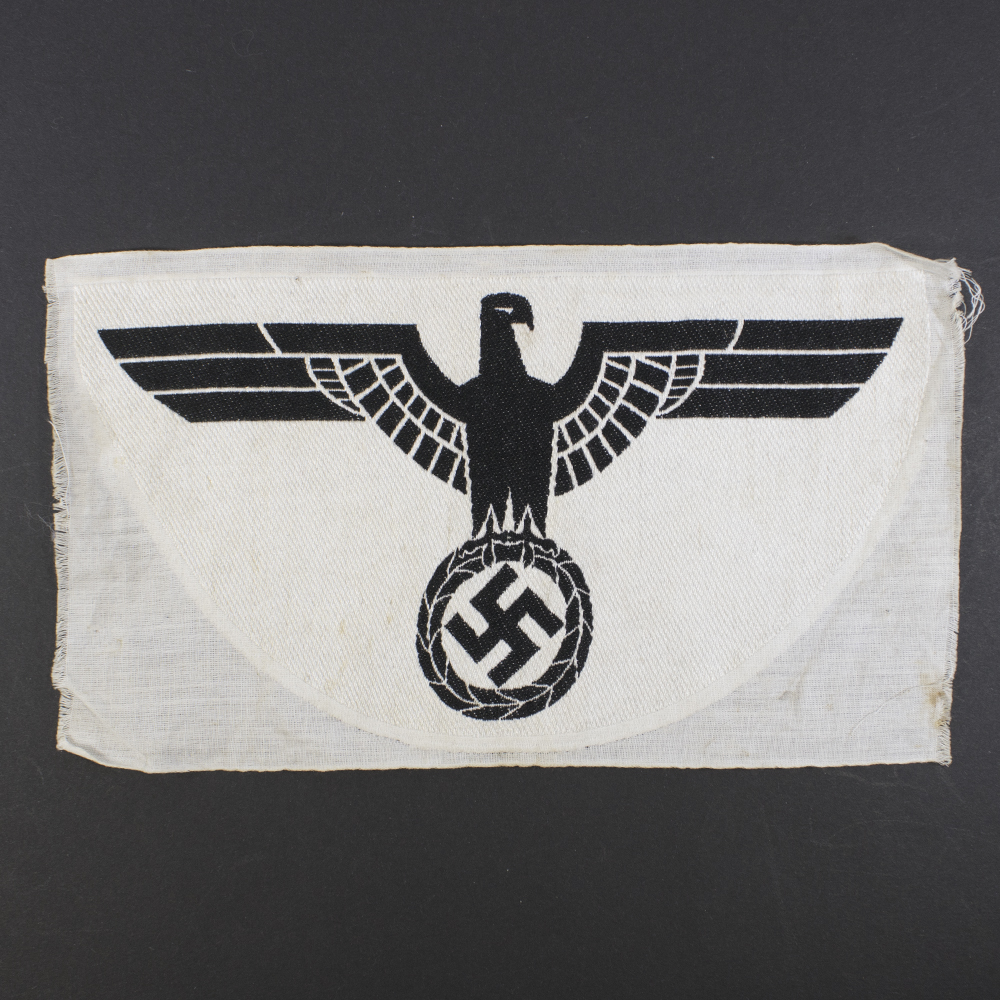 Overview of a 1st pattern WWII Heer Sports Breast Eagle cloth badge, showing the full embroidered eagle with spread wings.