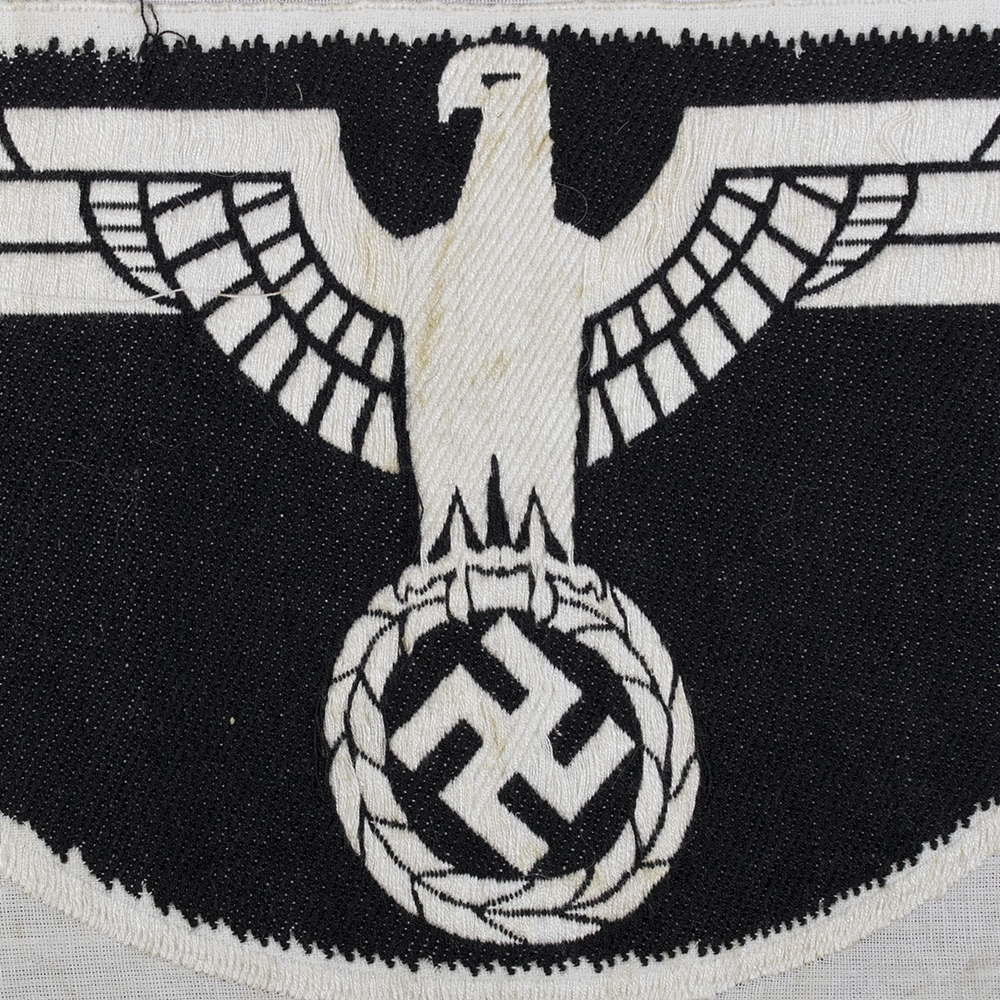 Close-up of the back of a 1st pattern WWII Heer Sports Breast Eagle cloth badge, showing the fabric texture and attachment stitching.