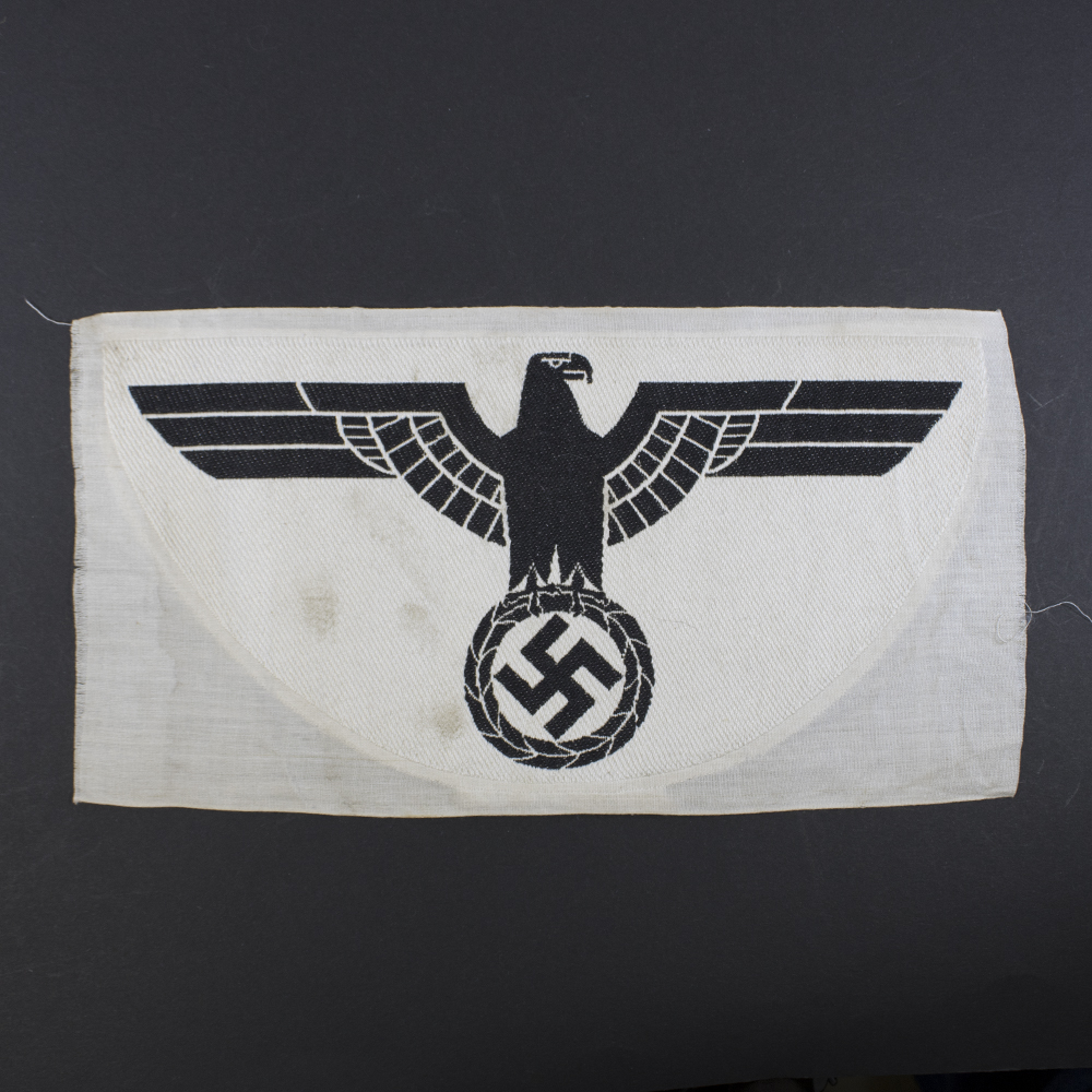 Overview of a 1st pattern WWII Heer Sports Breast Eagle cloth badge, showing the full embroidered eagle with spread wings.