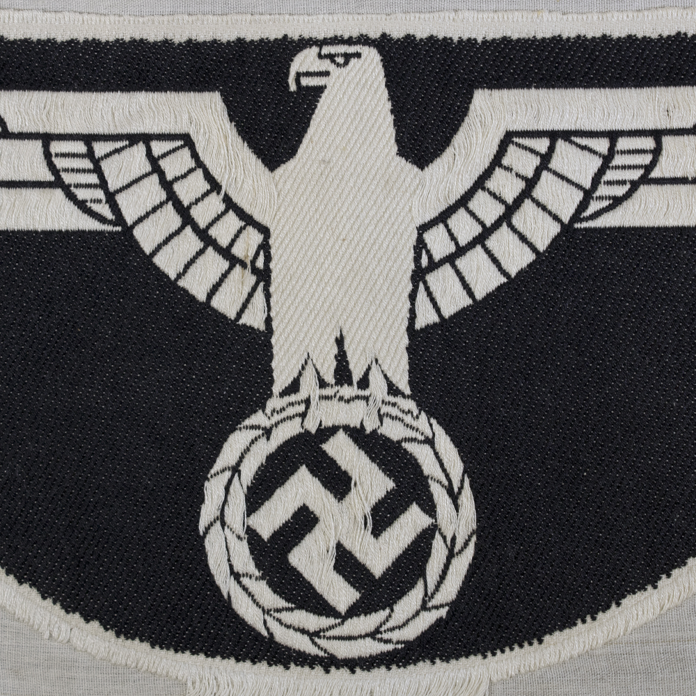 Close-up of the back of a 1st pattern WWII Heer Sports Breast Eagle cloth badge, showing the fabric texture and attachment stitching.