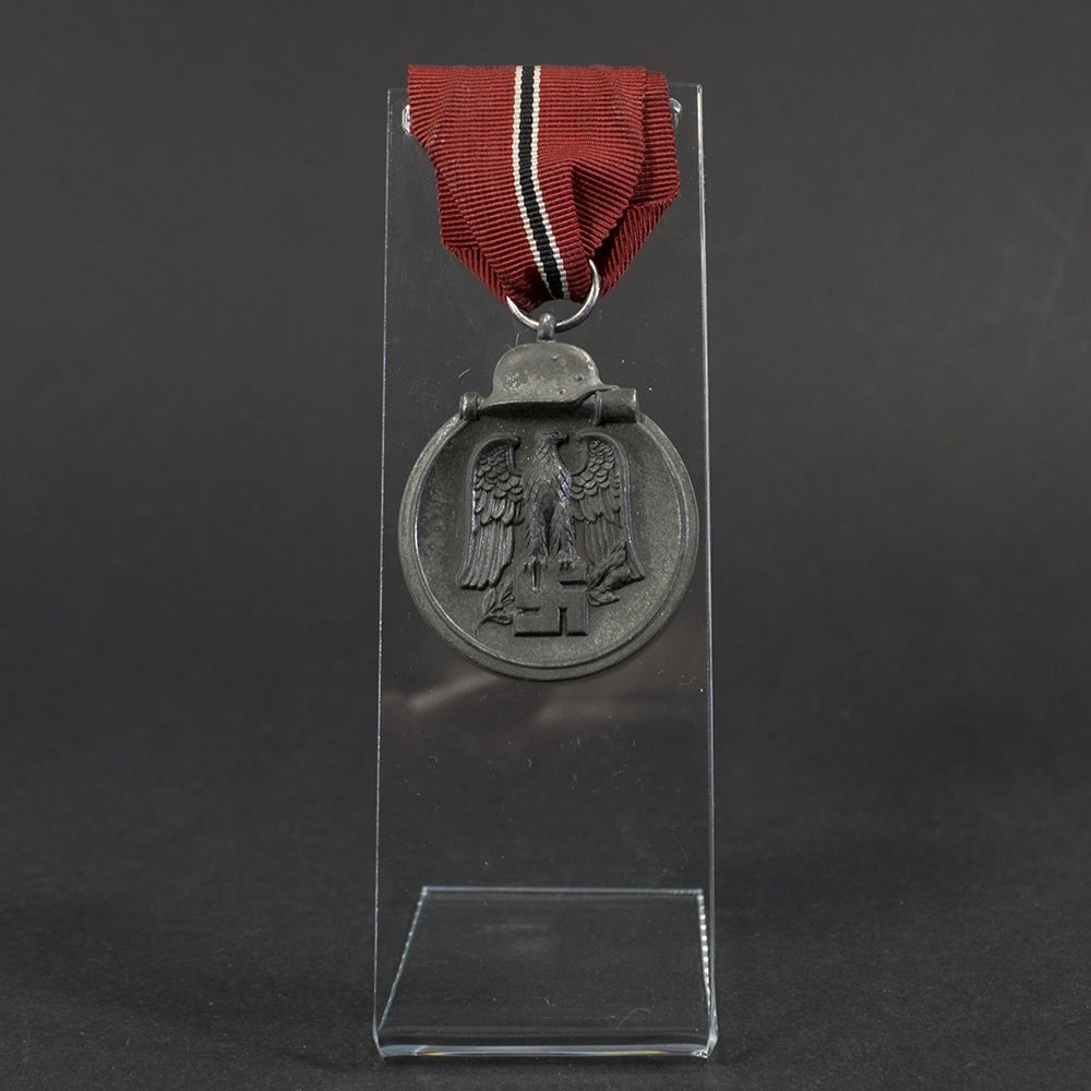 Overview of a WWII Eastern Front Medal, showing the full medal with suspension ring.