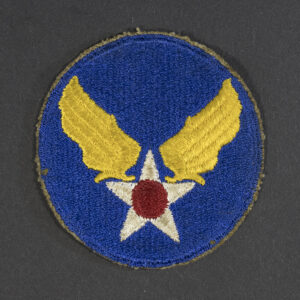 Front of WWII U.S. Army Air Forces patch with green backing, showing emblem and shield shape in good condition.