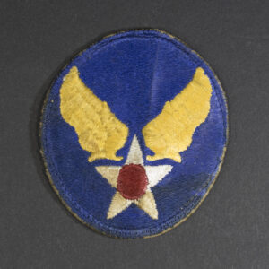 Front of WWII U.S. Army Air Forces patch with green backing, showing emblem and shield shape in good condition.