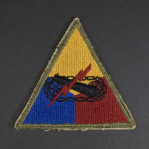 Front of WWII U.S. Army Armored Forces patch, featuring tank emblem on shield shape in good condition