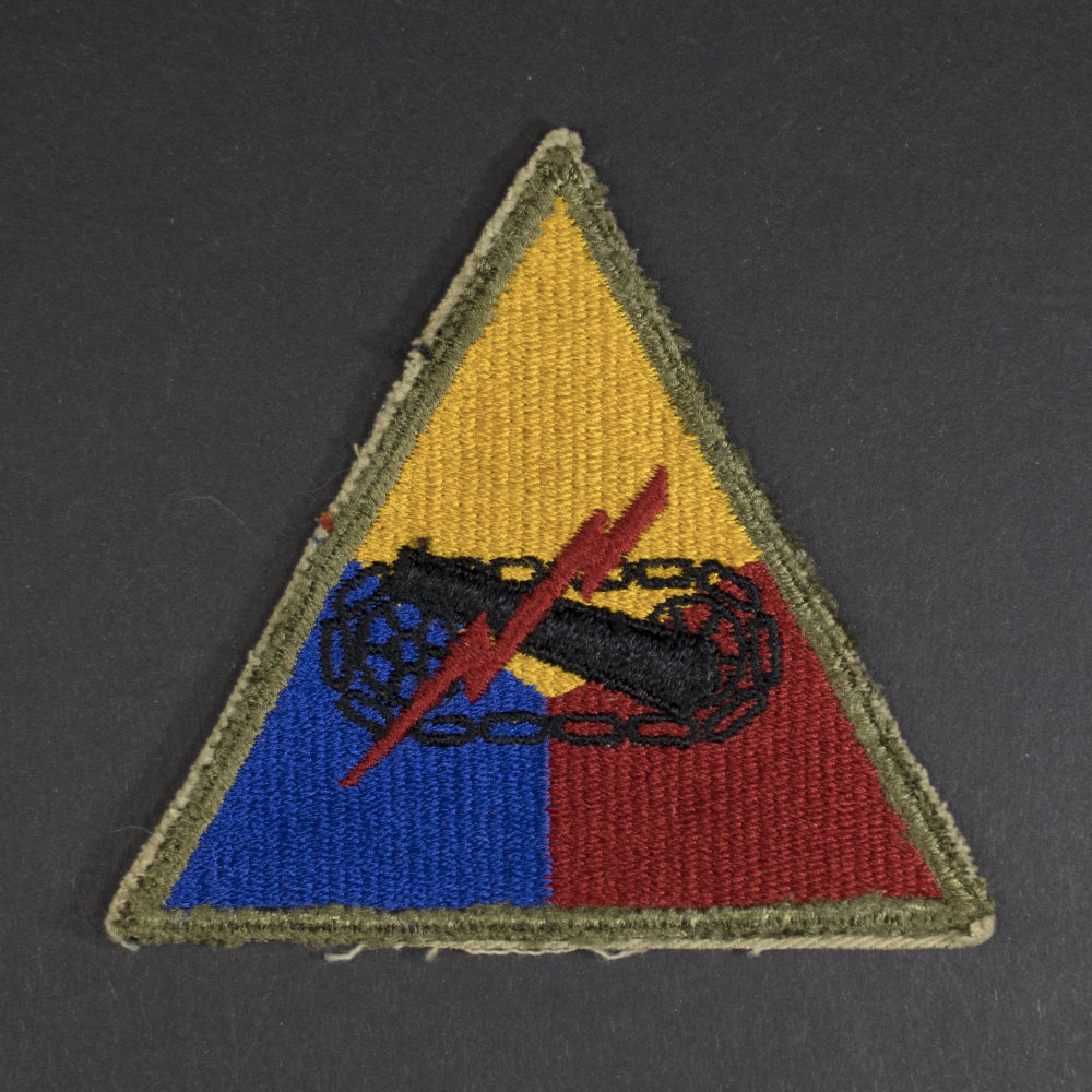 Front of WWII U.S. Army Armored Forces patch, featuring tank emblem on shield shape in good condition