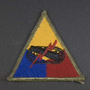 Front of WWII U.S. Army Armored Forces patch, featuring tank emblem on shield shape in good condition.