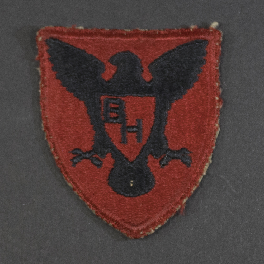 Front of WWII U.S. Army 86th Infantry Division patch, featuring black Gothic cross on olive background in good condition.