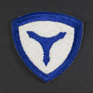 Front of WWII U.S. Army 3rd Service Command patch, featuring blue circle with white star and red center, surrounded by a yellow border.