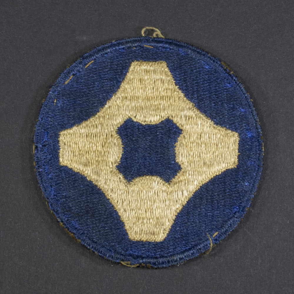 Front of WWII U.S. Army 4th Service Command patch, featuring blue circle with white star and red center, surrounded by a green border.