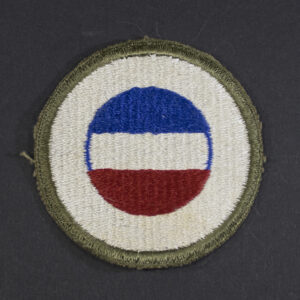Front of WWII U.S. Army General Headquarters Reserve patch, featuring blue shield with white star and red center in good condition