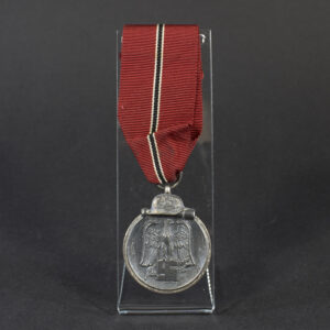 Overview photo of a World War II Eastern Front Medal (Ostmedaille) with ribbon, showing the full design and overall condition.