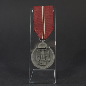Overview photo of a World War II Eastern Front Medal (Ostmedaille) with ribbon, showing the full medal and overall condition.