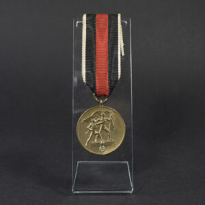 Overview photo of a World War II Anschluss Sudetenland Medal, showing the full medal with suspension ring and overall condition.”