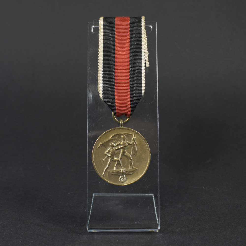Overview photo of a World War II Anschluss Sudetenland Medal, showing the full medal with suspension ring and overall condition.”