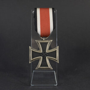 Overview photo of a World War II Iron Cross 2nd Class with ribbon, showing the full medal and overall condition.