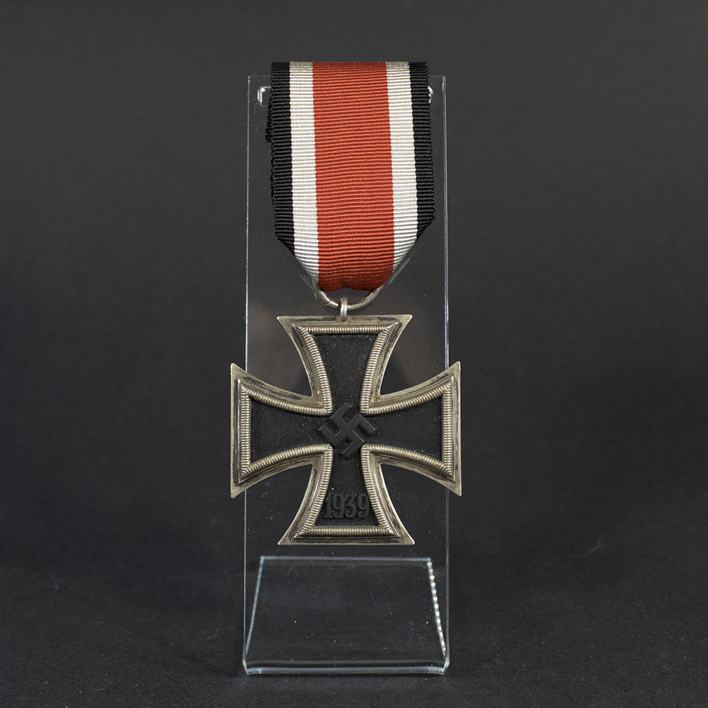 Overview photo of a World War II Iron Cross 2nd Class with ribbon, showing the full medal and overall condition.