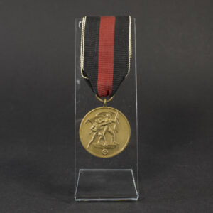 Full view of a World War II German Sudetenland Occupation Medal with its red‑white‑black striped ribbon, showing the complete medal and suspension.