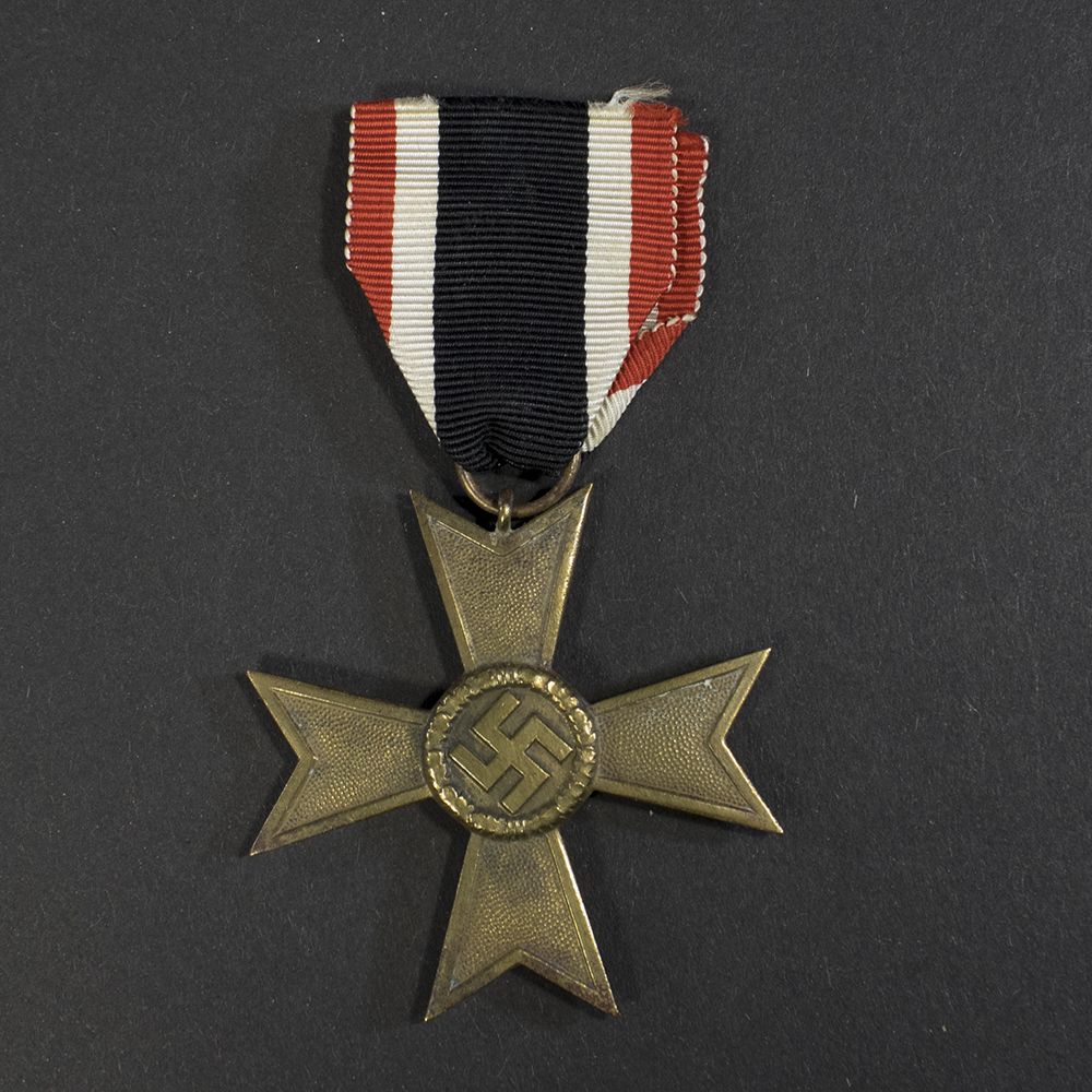 Full view of a World War II German War Merit Cross 2nd Class without Swords, showing the bronze‑colored Maltese‑style cross and its red‑white‑black striped ribbon.
