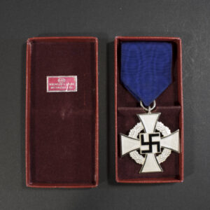 Back view of the silver‑finish Faithful Service Medal in its open case, showing the reverse inscription and the detailed silver surface.