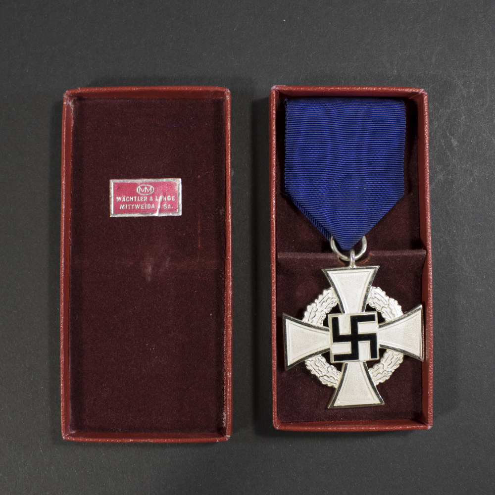 Back view of the silver‑finish Faithful Service Medal in its open case, showing the reverse inscription and the detailed silver surface.
