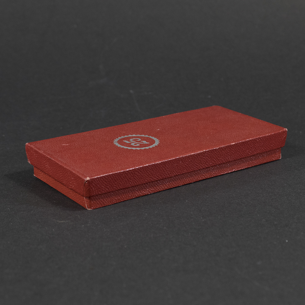 Second angled view of the closed WWII German Faithful Service Medal case, highlighting the clasp and overall condition.