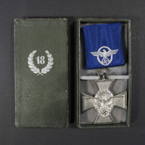 WW2-era German 18 Years Police Long Service Medal displayed inside its original presentation case.