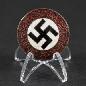 Front view of a WW2-era German NSDAP membership badge, showing the enamel design and central emblem.