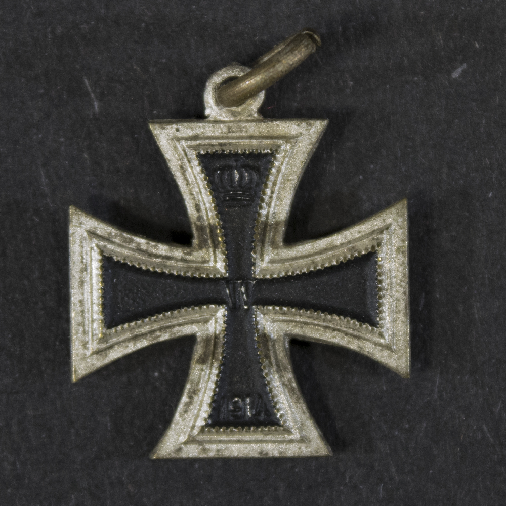 Front view of a German WW1 Iron Cross 2nd Class miniature (16 mm), showing the cross design and central core.
