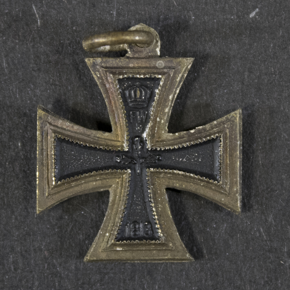 Back view of the WW1 Iron Cross 2nd Class miniature (16 mm), showing the reverse detail and suspension ring.