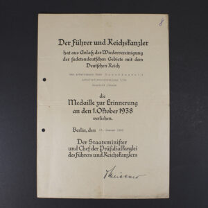 Front view of a WW2-era German Anschluss Sudetenland award document, showing the printed text, emblem, and layout.