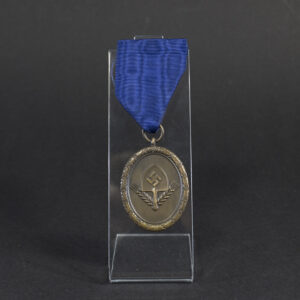 Overview of a WWII German RAD 4‑year long service medal, showing the bronze medal suspended from its original ribbon.