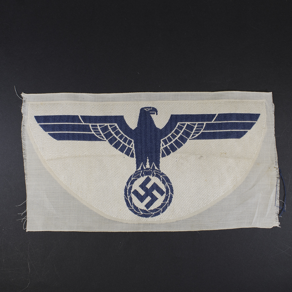 Overview of a WWII German Kriegsmarine cloth sports breast eagle, showing the complete embroidered insignia from the fron