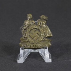 Overview of a WWII German “Mit Kraft durch Freude” Oberbayern 1935 tinnie, showing the complete event badge.