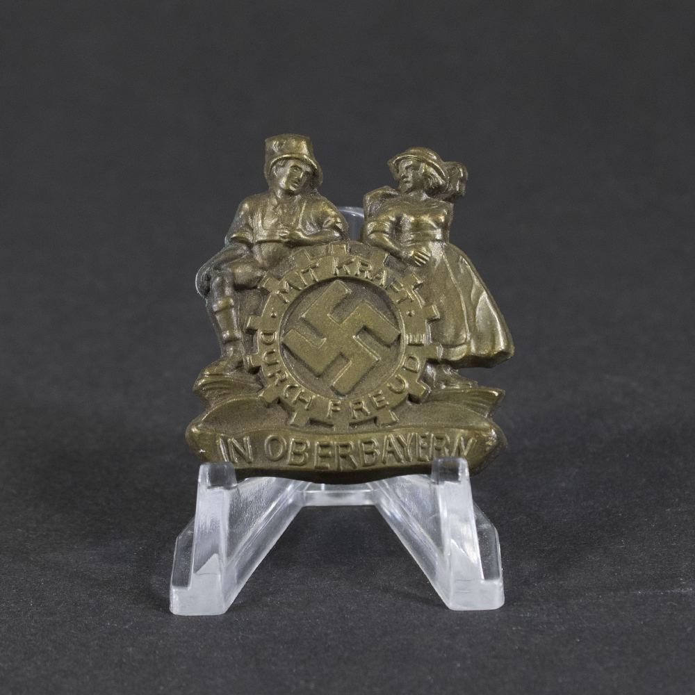 Overview of a WWII German “Mit Kraft durch Freude” Oberbayern 1935 tinnie, showing the complete event badge.