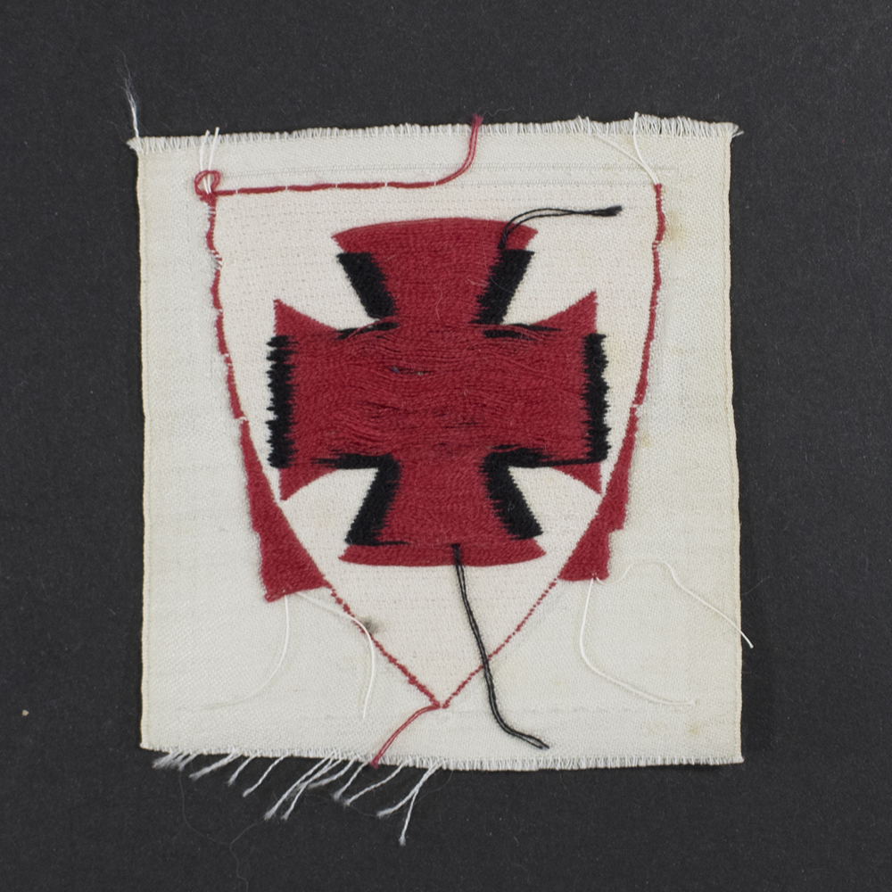 Back view of the Kyffhäuserbund sleeve insignia, showing the reverse side of the cloth with visible stitching, thread patterns, and the unfinished textile backing. The construction details and wear on the fabric are clearly visible.