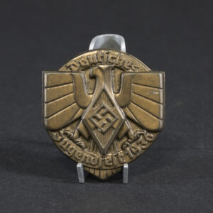 Overview of a WWII German tinnie from a Hitler Youth sports event held in 1936, showing the complete badge.