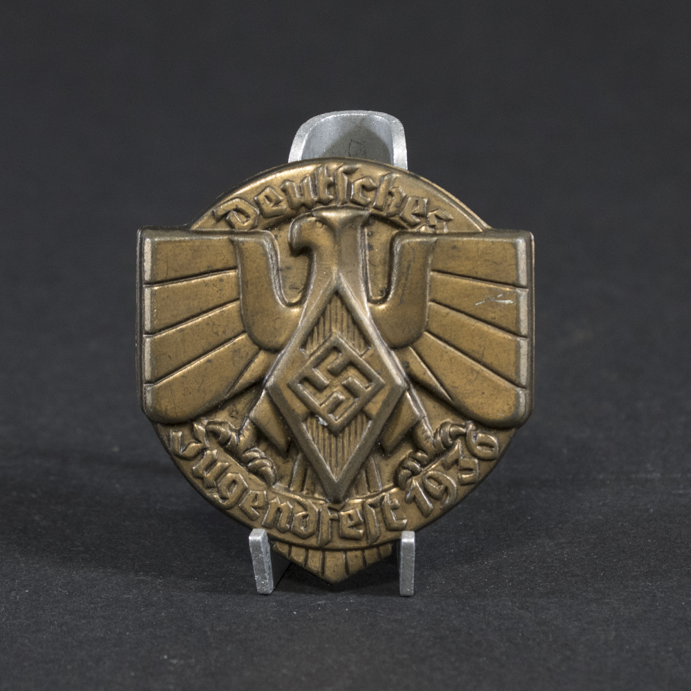 Overview of a WWII German tinnie from a Hitler Youth sports event held in 1936, showing the complete badge.