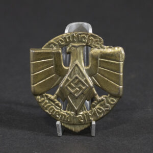 Overview of a WWII German tinnie from a Hitler Youth sports event held in 1936, showing the complete badge.