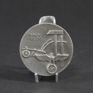 Overview of a WWII German “Tag der Arbeit” 1936 tinnie, showing the complete event badge.