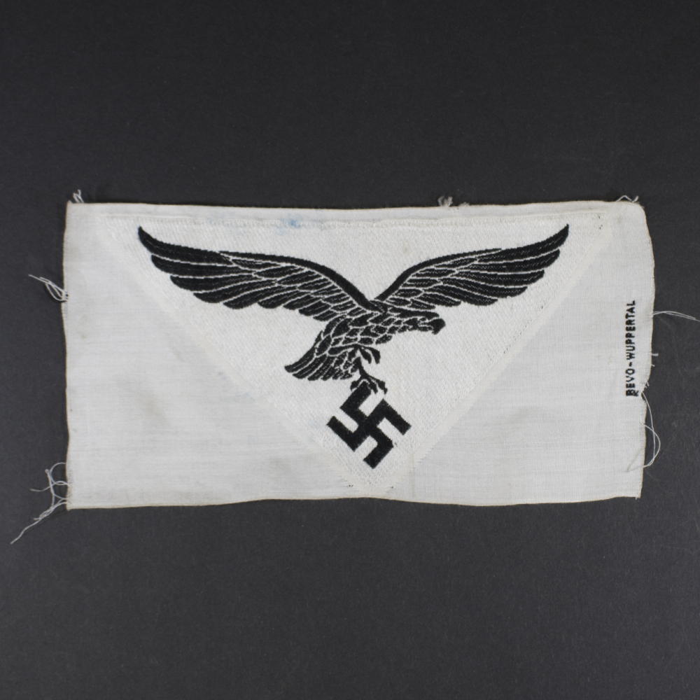 Overview of a WWII German Luftwaffe sports breast eagle made of cloth, showing the complete embroidered insignia from the front.