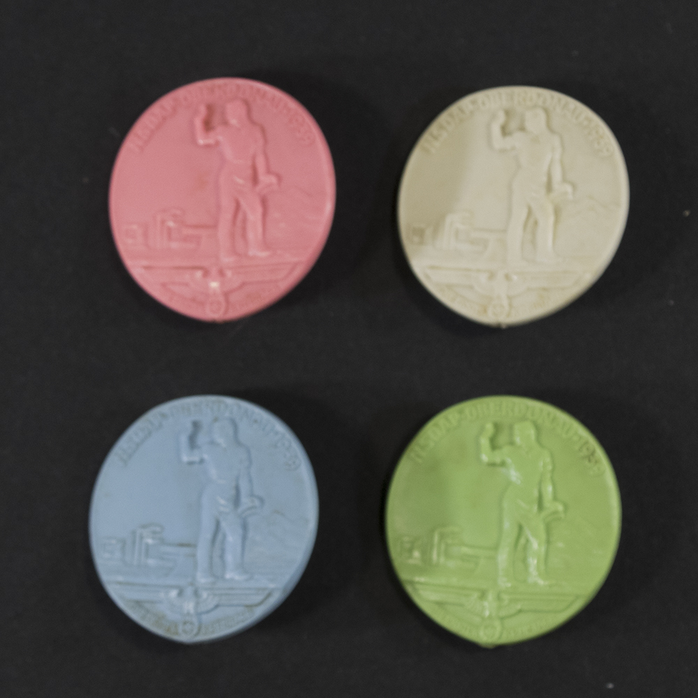 Front view of a set of 4 NSDP Oberdonau 1939 Kreistag Abzeichen badges. showing all their detail.