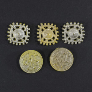 Front view of a set of 5 Winterhilfswerk badges.